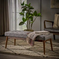 Banc ottoman en tissu capitonné