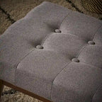 Banc ottoman en tissu capitonné