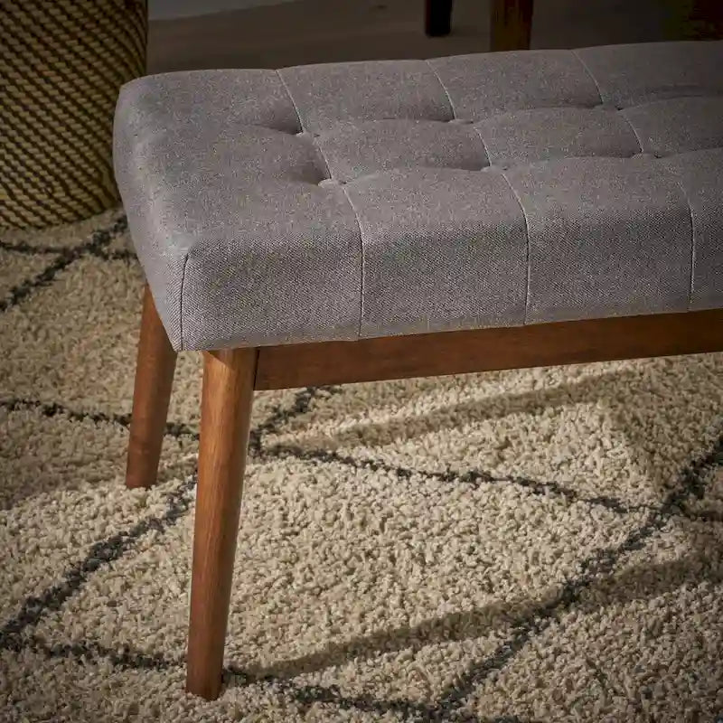 Banc ottoman en tissu capitonné