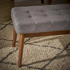 Banc ottoman en tissu capitonné
